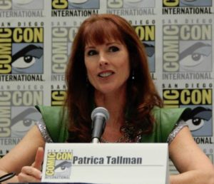 An image of Patricia Tallman speaking at a Comic Con panel.