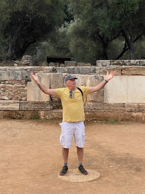 Glenn standing at the center of the amphitheater.