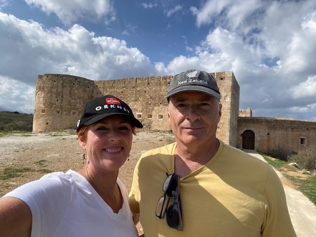 Pat and Glenn in front of a Greek structure.