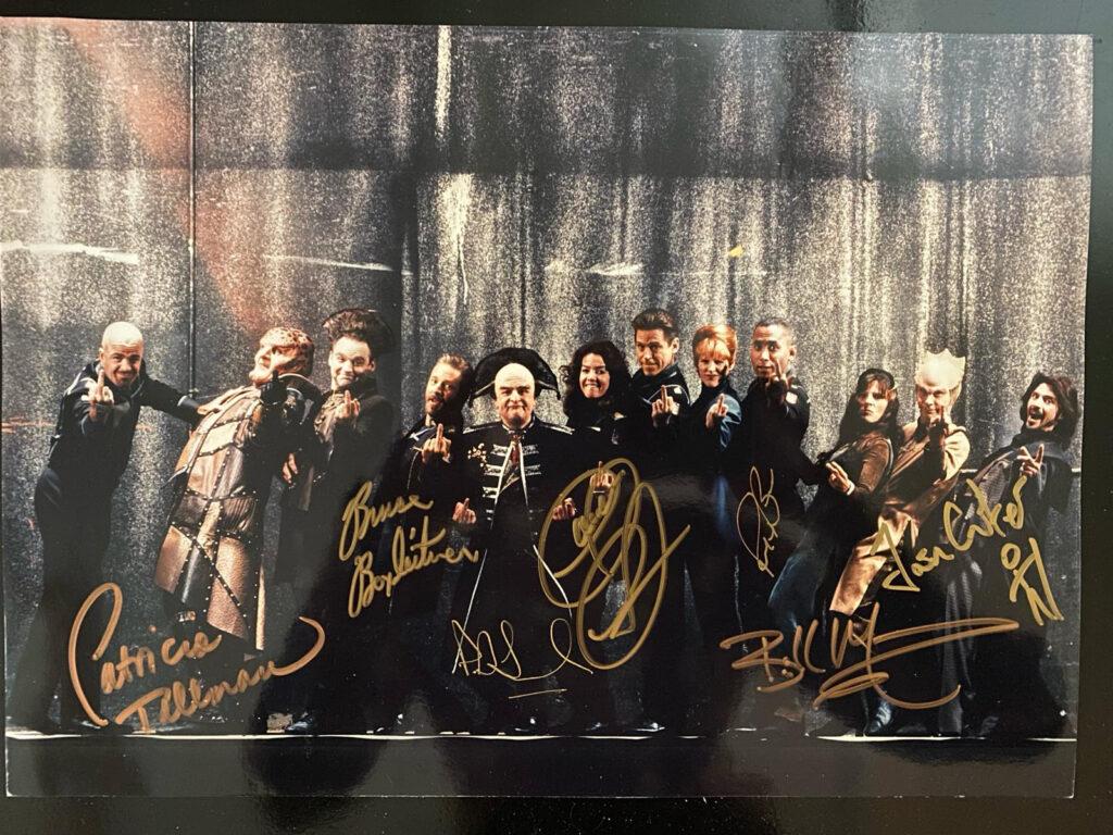 An image of the B5 cast flipping the bird for the infamous TV Guide photoshoot, now with seven signatures.